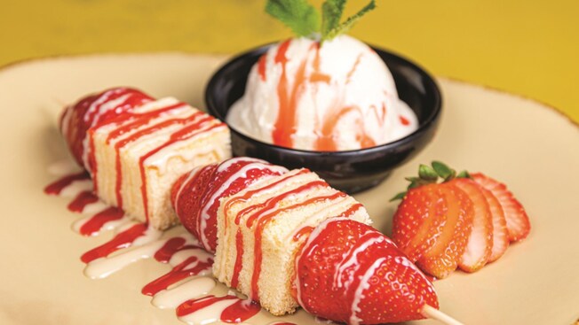 A plate of Florida Strawberry Shortcake Skewers and vanilla ice cream from T Rex