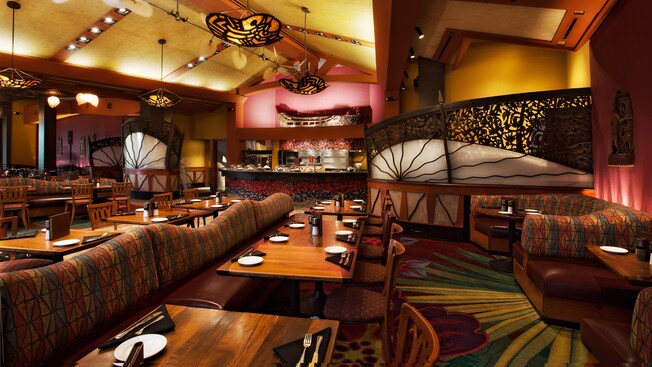 The colorful dining area of Kona Café, a restaurant at Disney's Polynesian Village Resort