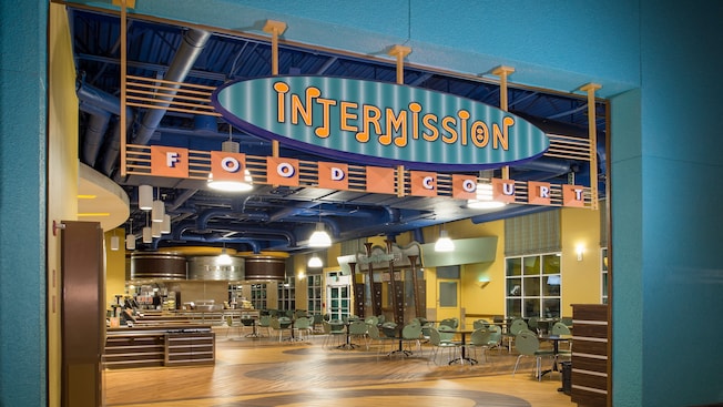 Vibrant signage featuring a series of musical notes near the entryway to the Intermission Food Court
