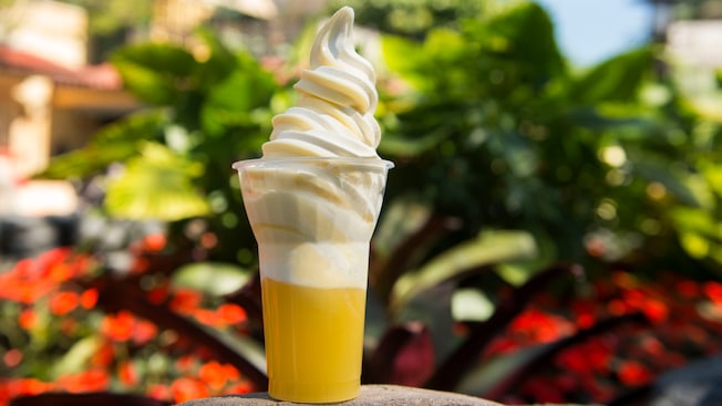 A classic Disney Dole WhipÂ® Soft-serve dessert drink in a cup with Coconut Rum.
