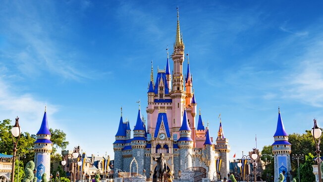 Partner statues featuring Mickey Mouse with Walt Disney in front of Cinderella Castle in Magic Kingdom park