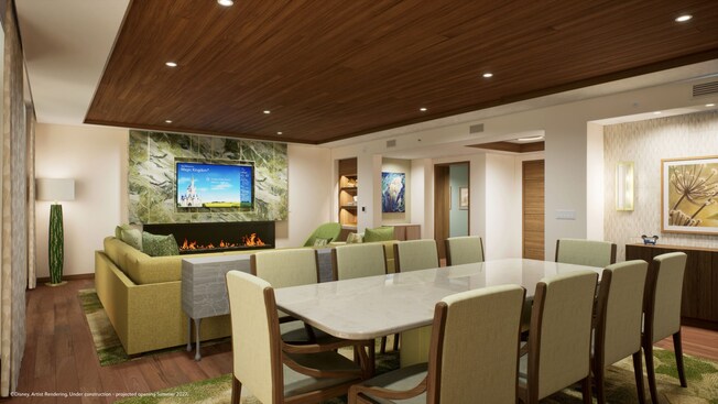 Grand Villa dining and living area with a large dining table and fireplace at Disney Lakeshore Lodge