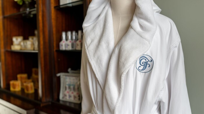 A robe with an embroidered ‘GF’ logo in a spa lobby at Disney’s Grand Floridian Resort & Spa