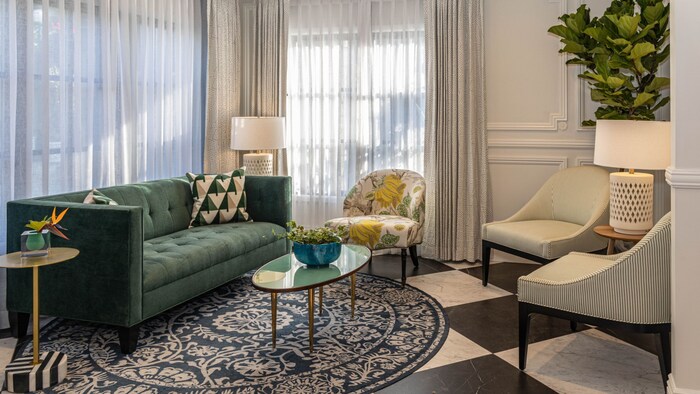 A sitting area in the Candy Cane Inn featuring a sofa, sitting chairs and coffee table