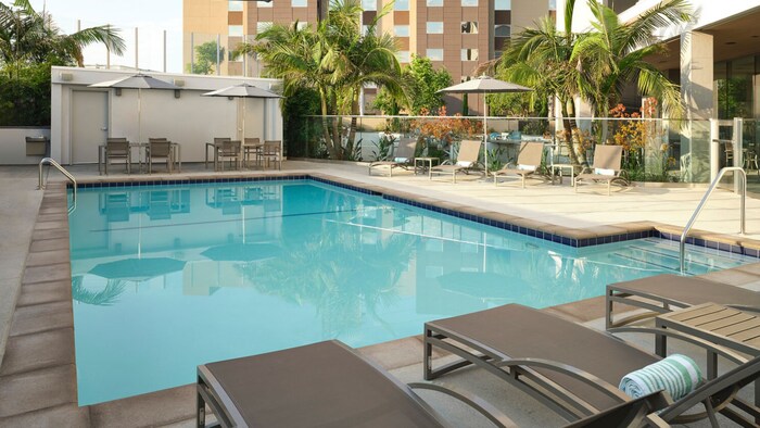 A pool and lounge chairs.