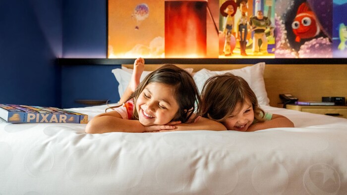Two children relax in their hotel room at the Disneyland Resort