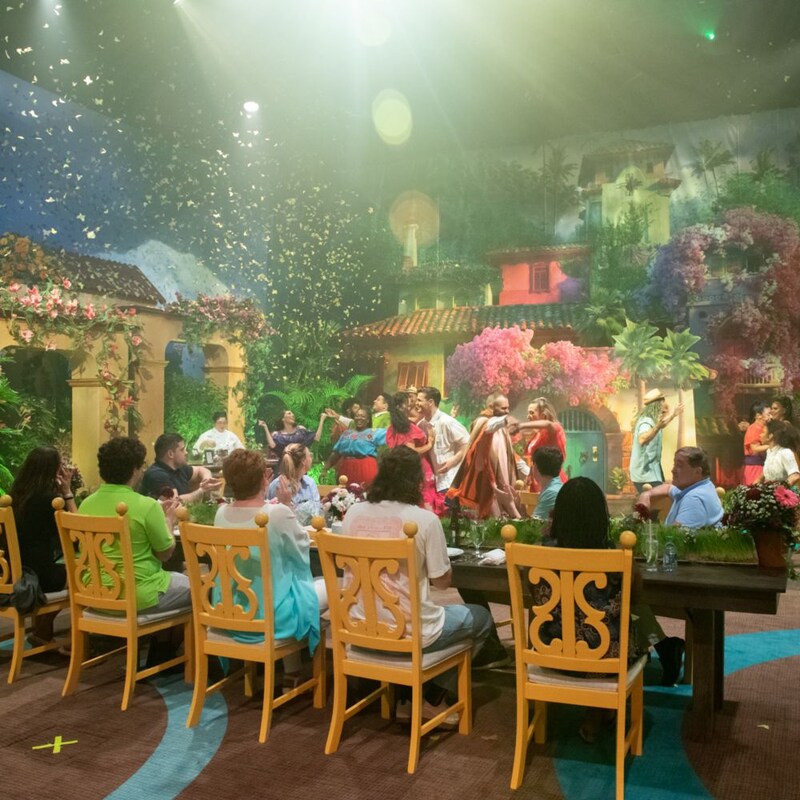 Cast Members dance at an Encanto themed event