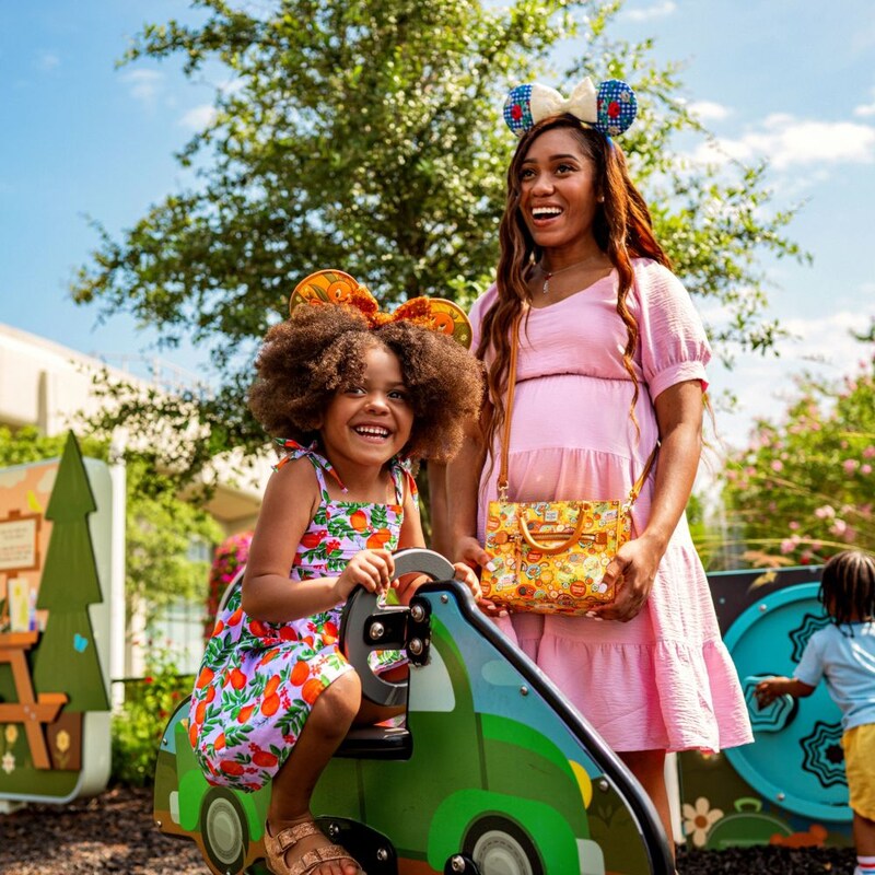 A mother and daughter enjoying a play zone during the Epcot International Flower and Garden Festival