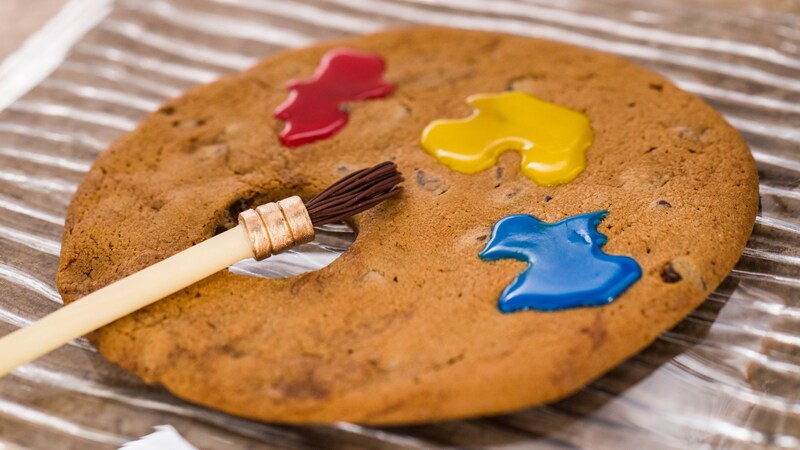 An Artist Palette Jumbo Chocolate Chip Cookie with a paintbrush