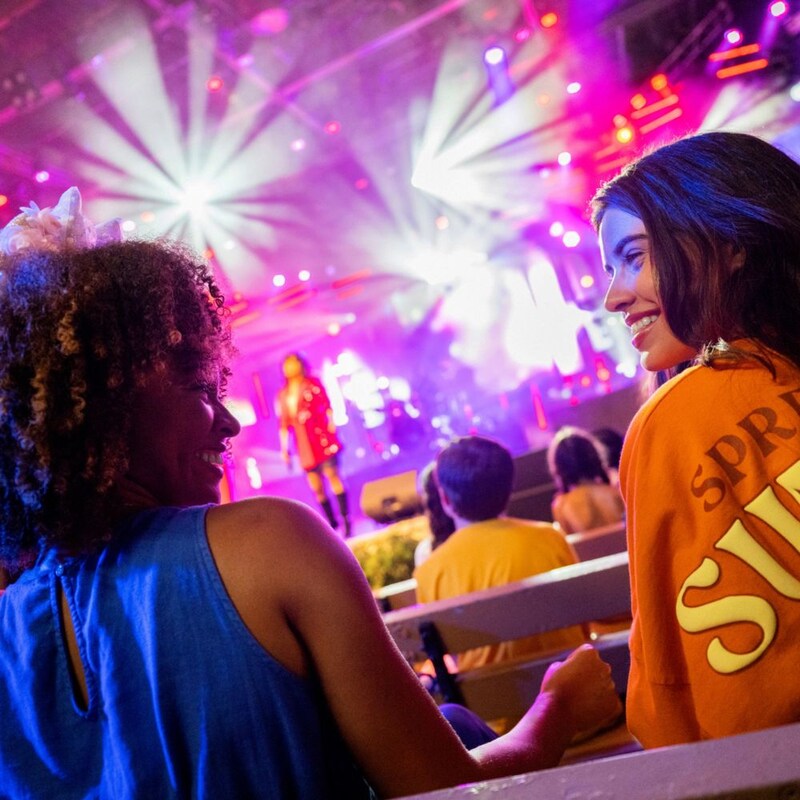 Two Guests enjoying a live music show at the Epcot International Flower and Garden Festival