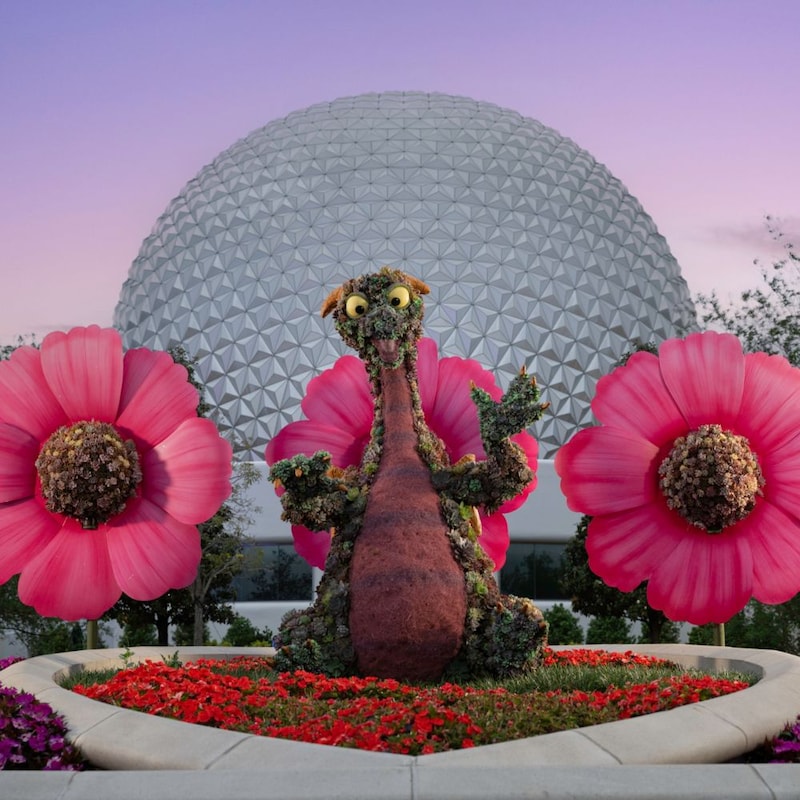 A topiary statue of Figment with large flowers at the Epcot International Flower & Garden Festival
