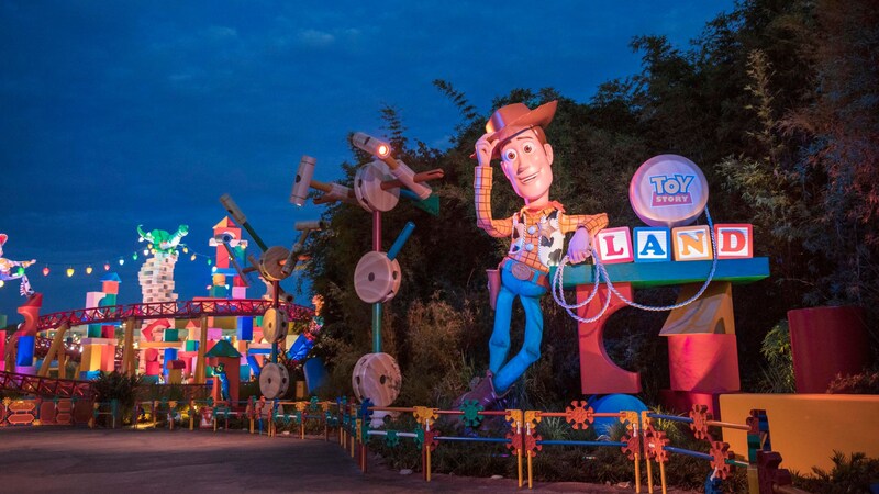 The entrance to Toy Story Land reveals a larger than lifesize figure of Sheriff Woody