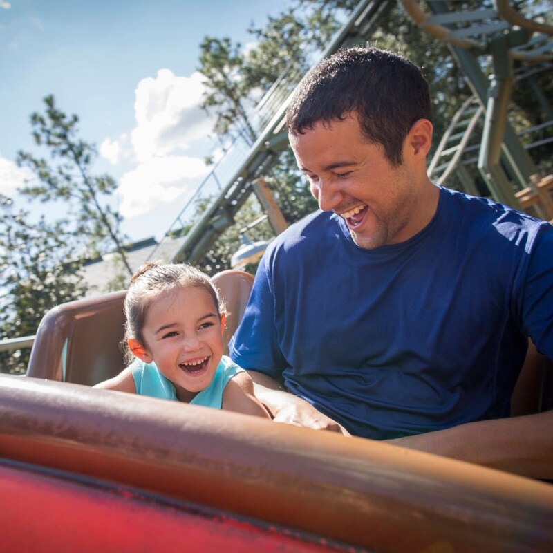 A father and daughter enjoy The Barnstormer together after using the Rider Switch option in line