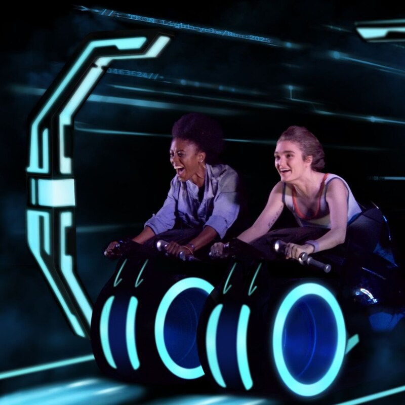 Two Guests riding on Tron Lightcycle Run