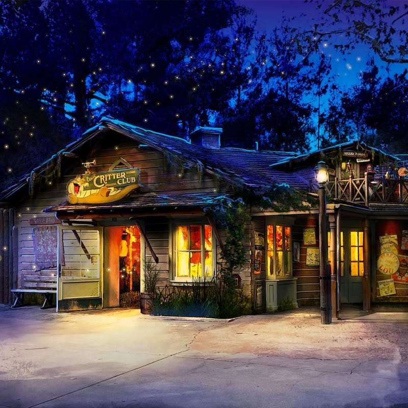 The façade of Louis Critter Club, a merchandise store at the Disneyland Resort, lit up at night