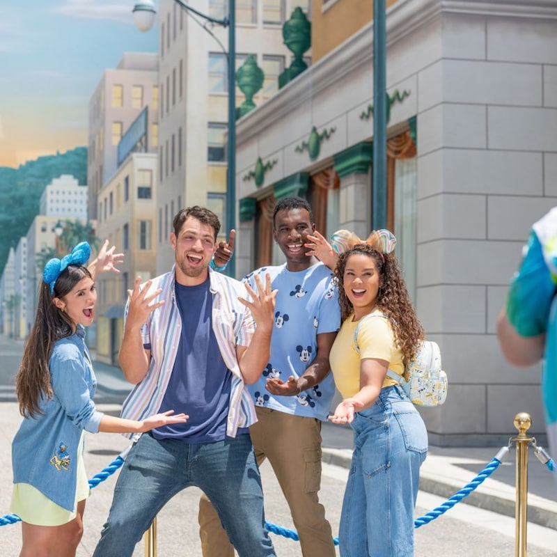 A group of 4 friends pose for a photo at Disney California Adventure Park