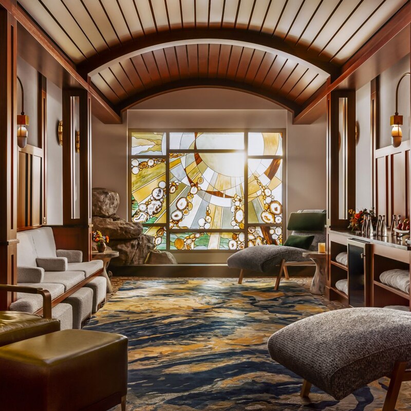 A peaceful relaxation room, lit with soft natural light through a stained glass window.