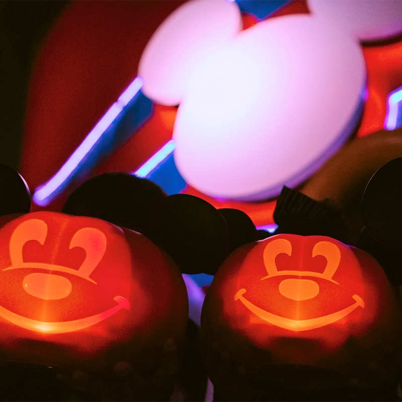 Two glowing smiling pumpkins with Mickey Mouse ears on a Disney Cruise Line ship