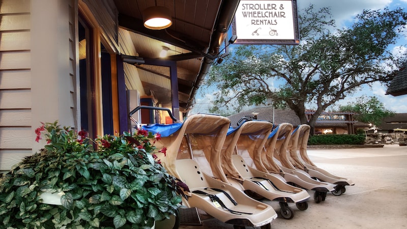  A row of strollers parking in front of a stroller and wheelchair rental location
