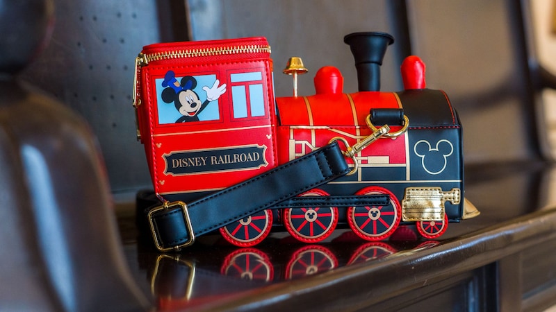 A Disney Railroad engine shaped handbag with Mickey Mouse as conductor