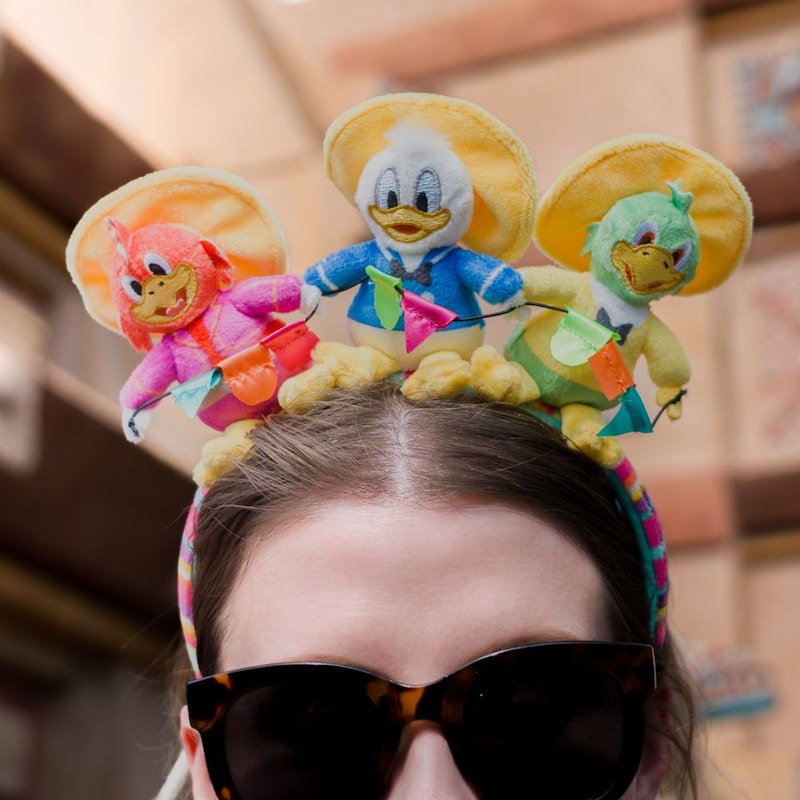 A Guest wearing a 3 Caballeros headband