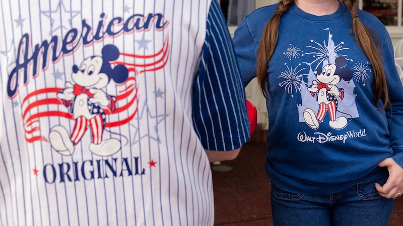 Two Guests in Disney merchandise commemorating America’s 250th Independence Day