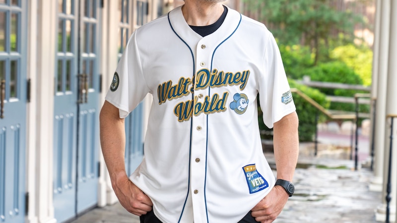 A man wearing a Walt Disney World baseball jersey