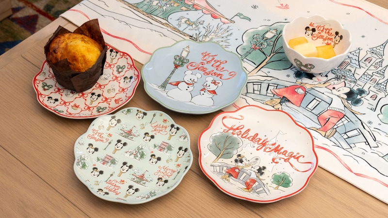 Holiday themed decorative plates and a small bowl featuring winter illustrations of Mickey Mouse and Minnie Mouse