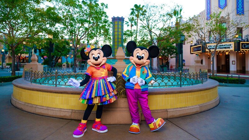 Minnie Mouse and Mickey Mouse wearing matching outfits for the 25th anniversary of Disney California Adventure Park