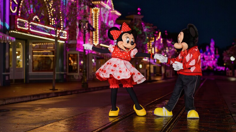 Minnie Mouse and Mickey Mouse dancing together on Main Street, USA in Disneyland Park