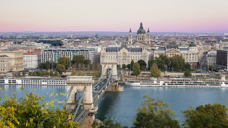 The city of Budapest, Hungary and a bridge spanning the Danube River