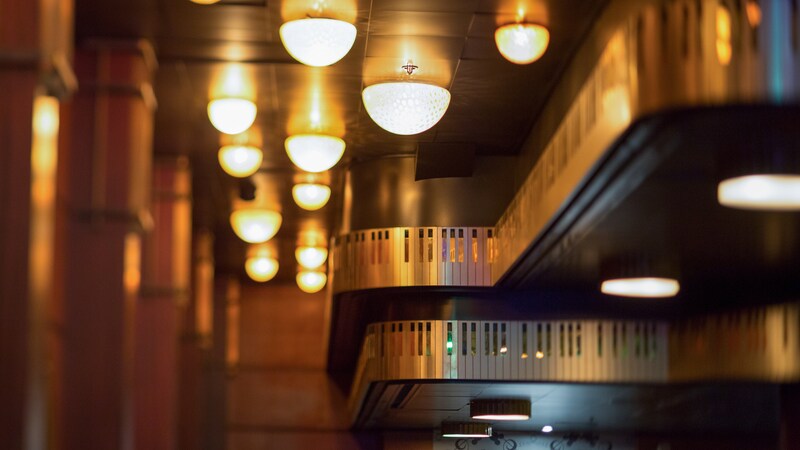 A tiered ceiling has molding in a piano keyboard design