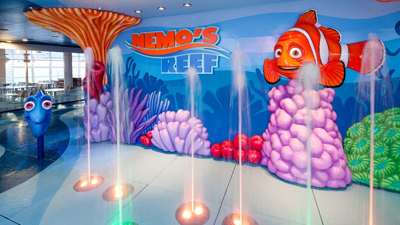 An enclosed water play area featuring water jets and characters from the Disney movie 'Finding Nemo'