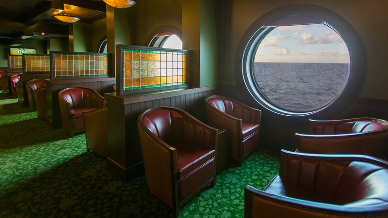 A lounge has wall partitions for privacy between rows of comfortable chairs