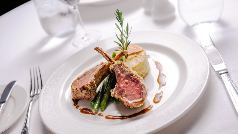 Double cut rack of lamb with a Dijon crust with fine green beans, gratin potatoes and rosemary jus