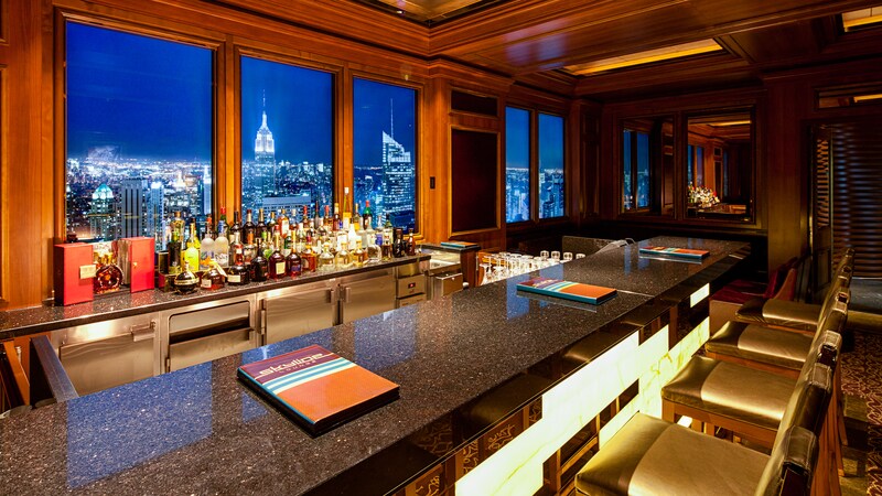 The panels behind a granite bar show a mural designed to create a convincing cityscape view