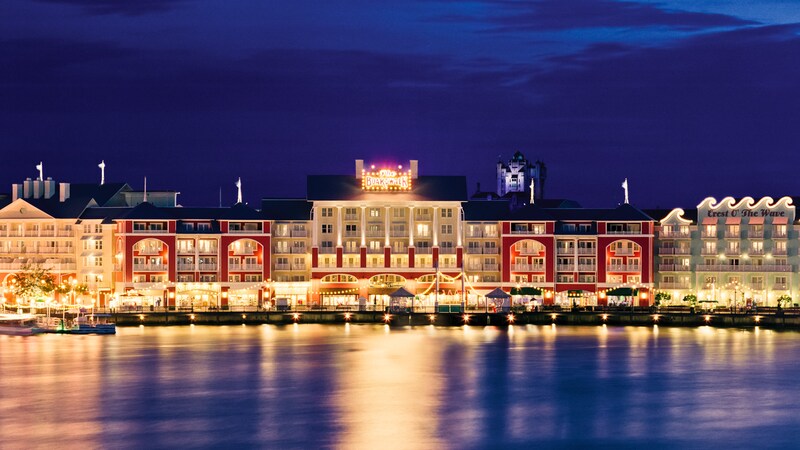 Disney’s BoardWalk area lit up at night as seen from Crescent Lake