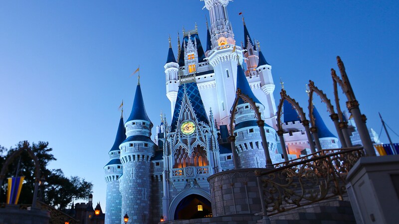 Cinderella Castle towering into the evening sky above Magic Kingdom park at Walt Disney World Resort