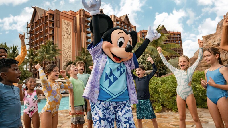 Mickey Mouse dancing with a group of children next to one of the pools at Aulani, A Disney Resort & Spa
