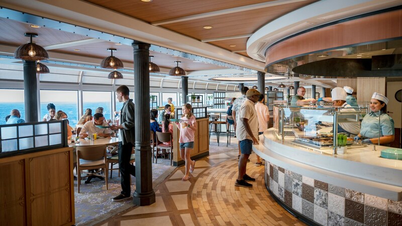 Guests dining at Marceline Market on board the Disney Destiny ship