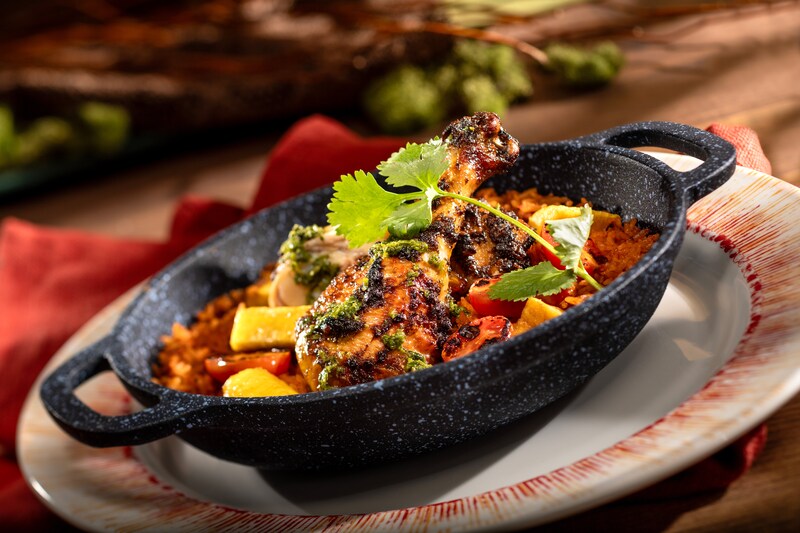 Pan served berbere spiced chicken from Pride Lands, Feast of the Lion King