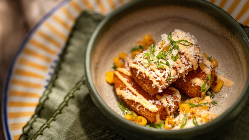 Chorizo Street Croquettes with chili-lime crema, corn, cotija cheese and cilantro