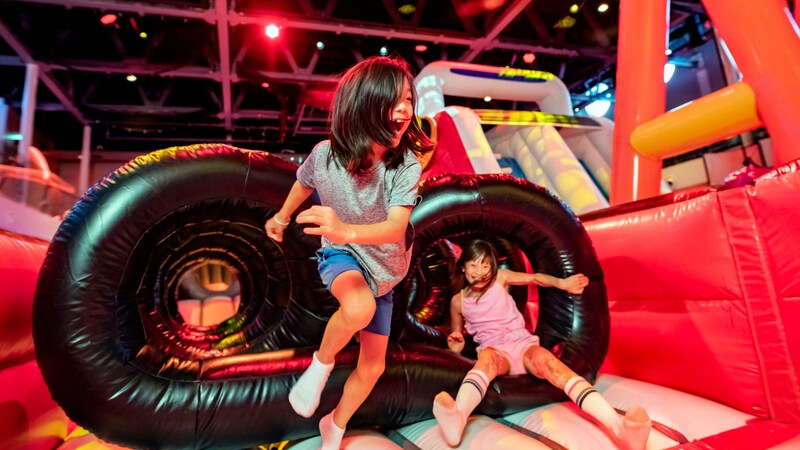 Two children play in the recreational space Hero Zone on board the Disney Destiny ship 