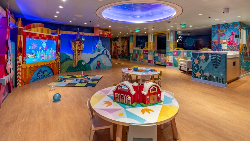 A nursery aboard a Disney cruise ship featuring décor themed after the Disney attraction It’s a Small World 