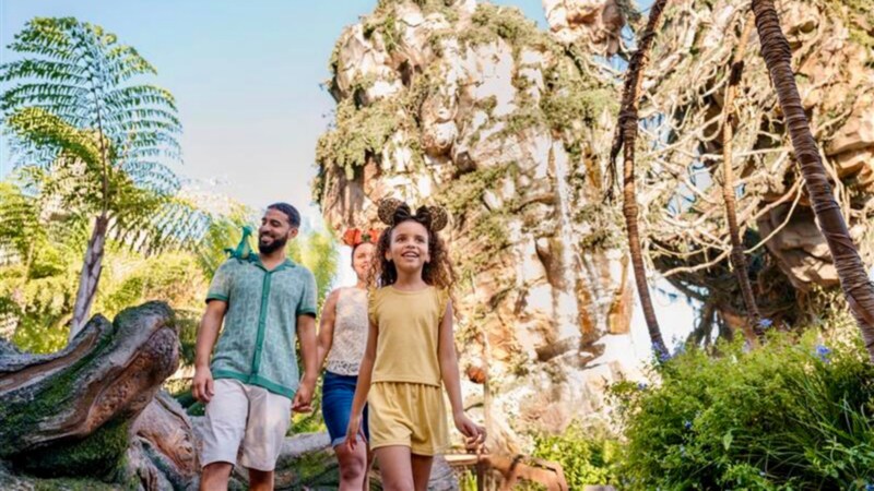 Three Guests walking through the outdoor queue for Na'vi River Journey