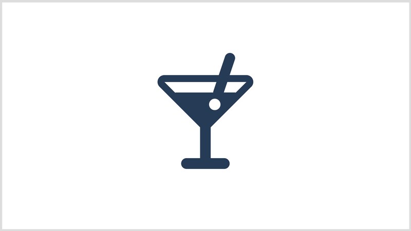 An icon of a martini glass filled with a drink and a straw representing cocktails