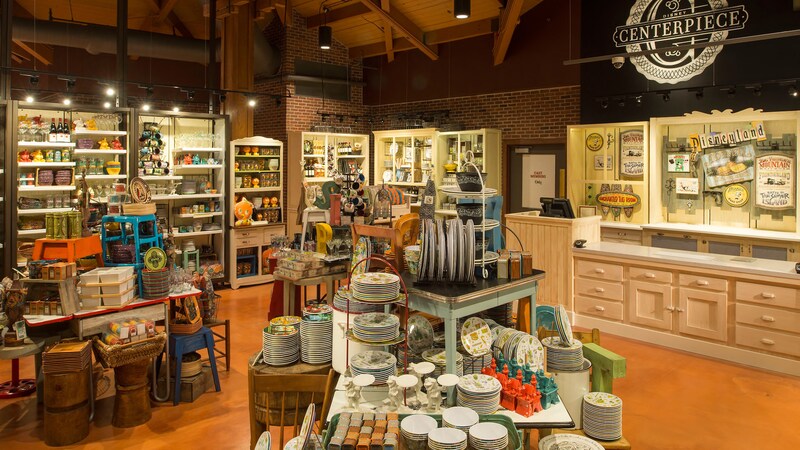 A shop with cabinetry and displays of dinnerware, ceramics, baskets and home furnishings