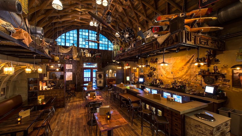 The interior dining area and bar of Jock Lindsey’s Hangar Bar