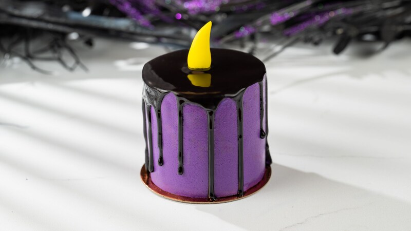 A petit cake resembling a candle with melting wax