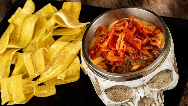 Skull of the Dead Dip served in a skull shaped bowl with plantain chips at Jock Lindsey’s Hangar Bar